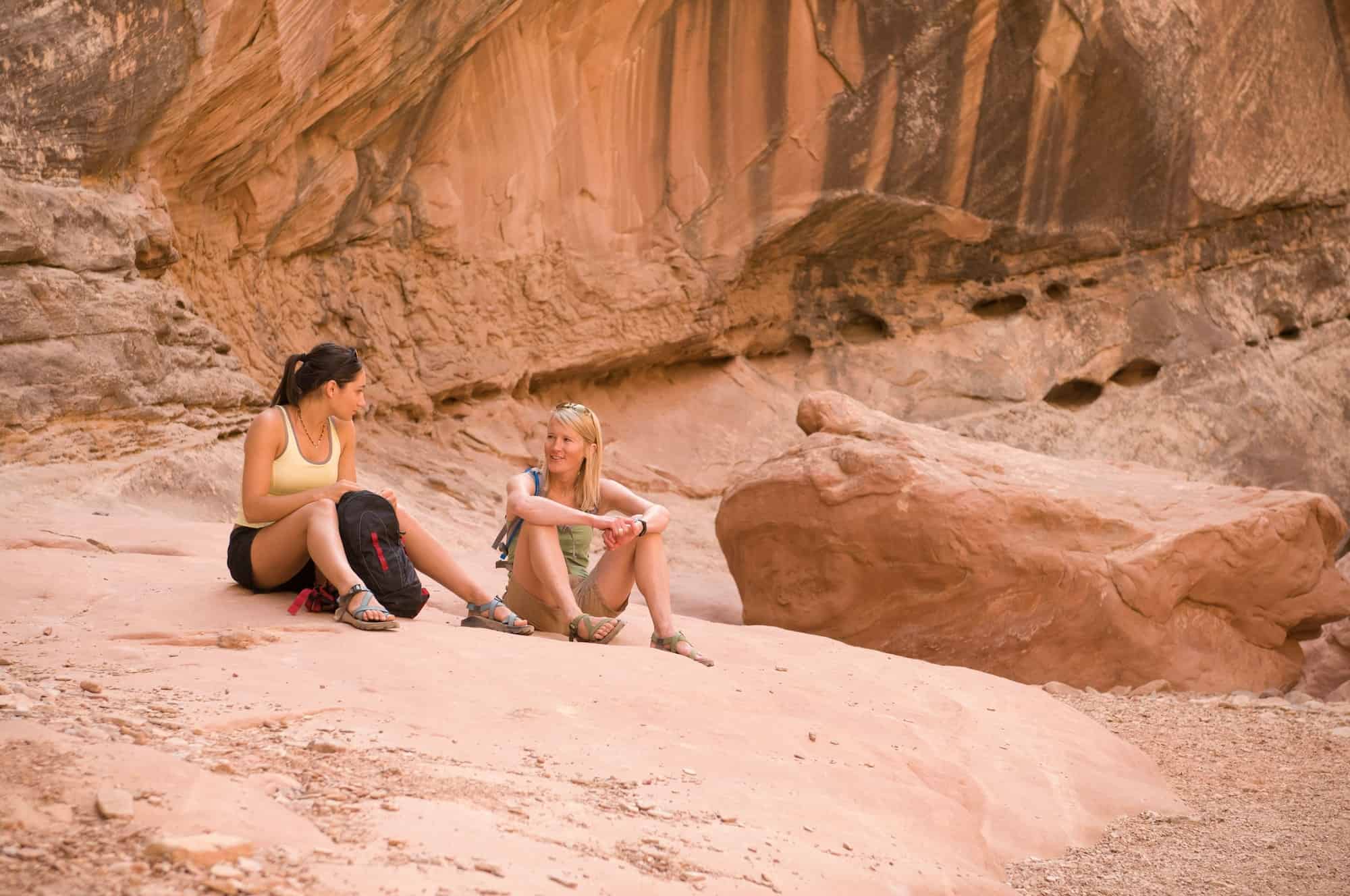 rock-climbers-relaxing-on-boulder.jpg